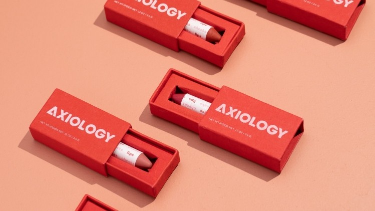 Axiology is expanding from 100 Ulta locations to 200 with their lip balm and highlighter. Image courtesy of Axiology